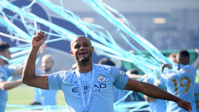 Manchester City&#39;s Vincent Kompany celebrates winning the Premier League title.