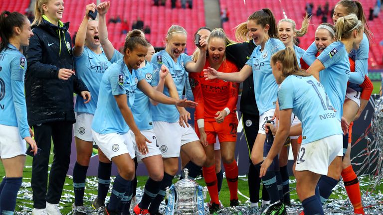 Manchester City players celebrate with the Women's FA Cup Trophy following their team's victory in the Women's FA Cup Final match between Manchester City Women and West Ham United Ladies at Wembley Stadium on May 04, 2019 in London, England. 