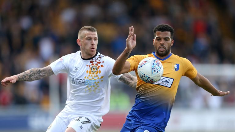Mansfield Town's Jacob Mellis (right) and Newport County's Scot Bennett battle for the ball during the Sky Bet League Two Play-off, Semi Final Second Leg match at the One Call Stadium, Mansfield. PRESS ASSOCIATION Photo. Picture date: Sunday May 12, 2019. See PA story SOCCER Mansfield. Photo credit should read: Barrington Coombs/PA Wire. RESTRICTIONS: EDITORIAL USE ONLY No use with unauthorised audio, video, data, fixture lists, club/league logos or "live" services. Online in-match use limited to 120 images, no video emulation. No use in betting, games or single club/league/player publications.