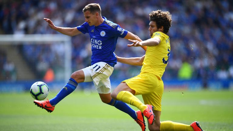 Marc Albrighton is challenged by Marcos Alonso