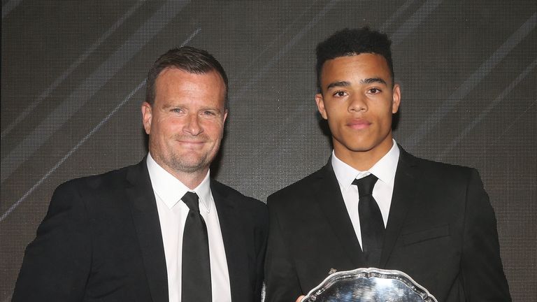 Mason Greenwood is presented with the Jimmy Murphy Youth Team Player of the Year award by U18s manager Neil Ryan 