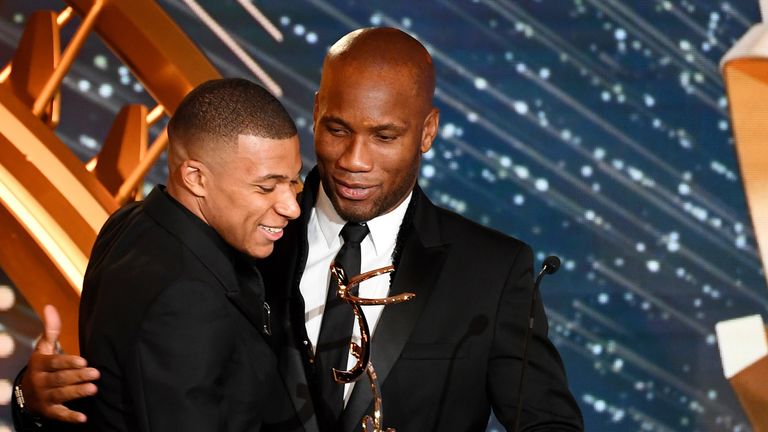 Kylian Mbappe was presented with Ligue 1's Player of the Year award by Didier Drogba