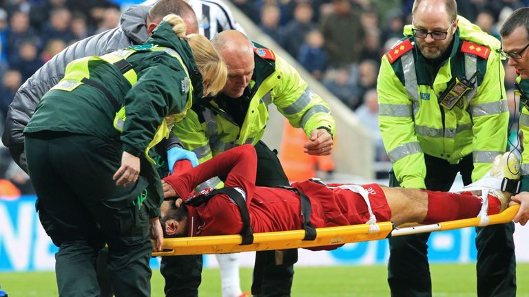 The Liverpool forward was carried off on a stretcher