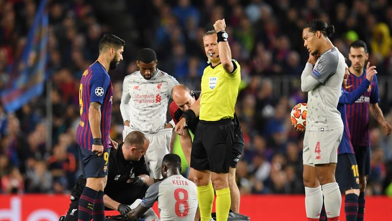 Naby Keita receives treatment on the pitch after suffering an injury during Liverpool's Champions League semi-final against Barcelona