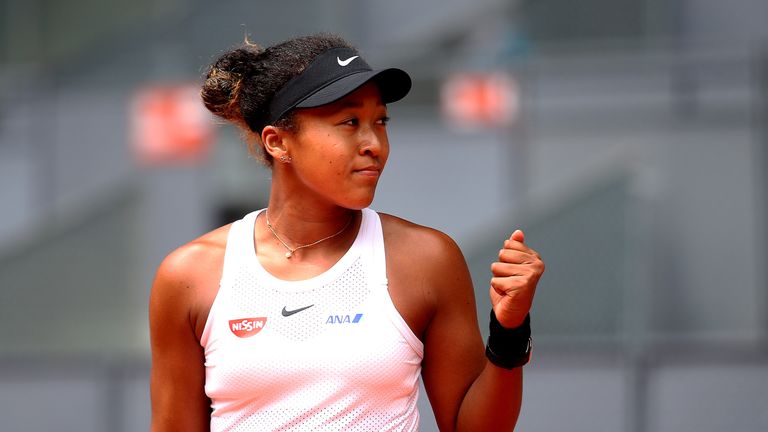 Naomi Osaka of Japan celebrates victory in her match against Aliksandra Sasnovic of Belarus during day five of the Mutua Madrid Open at La Caja Magica on May 08, 2019 in Madrid, Spain.
