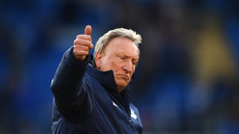 Neil Warnock gestures to Cardiff fans after their home defeat to Crystal Palace