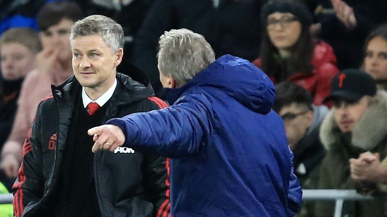 Neil Warnock, Manager of Cardiff City confronts Ole Gunnar Solskjaer, Interim Manager of Manchester United during the Premier League match between Cardiff City and Manchester United at Cardiff City Stadium on December 22, 2018 in Cardiff, United Kingdom.