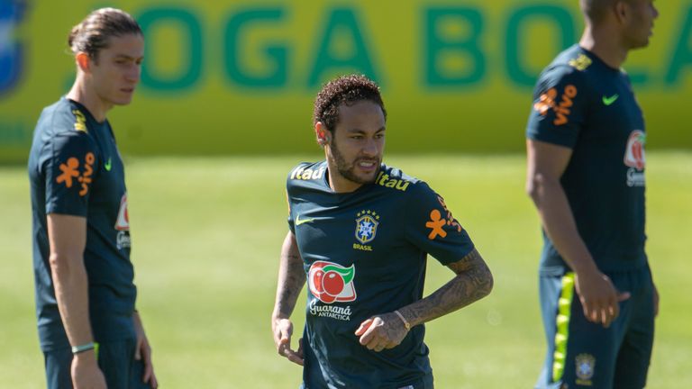 Neymar appeared to injure his left knee during Brazil's training session