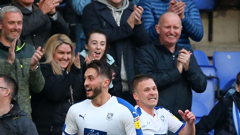 Ollie Banks celebrates with Jay Harris after scoring for Tranmere against Forest Green