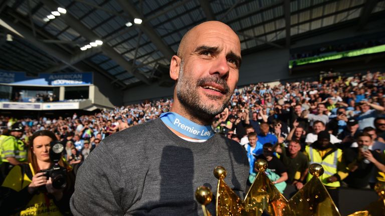 Pep Guardiola with the Premier League trophy at the AMEX Stadium