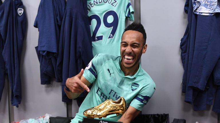 Pierre-Emerick Aubameyang poses with the Premier League golden boot award for the 2018/19 season