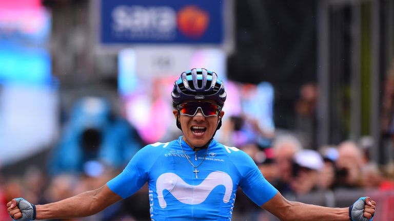 Ecuador's Richard Carapaz celebrates his victory as he crosses the finish line to win stage 14