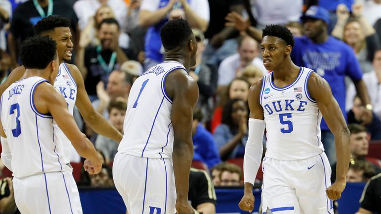 Zion Williamson #1 of the Duke Blue Devils celebrates with RJ Barrett #5 and Tre Jones #3 against the UCF Knights during the first half in the second round game of the 2019 NCAA Men's Basketball Tournament at Colonial Life Arena on March 24, 2019 in Columbia, South Carolina. 