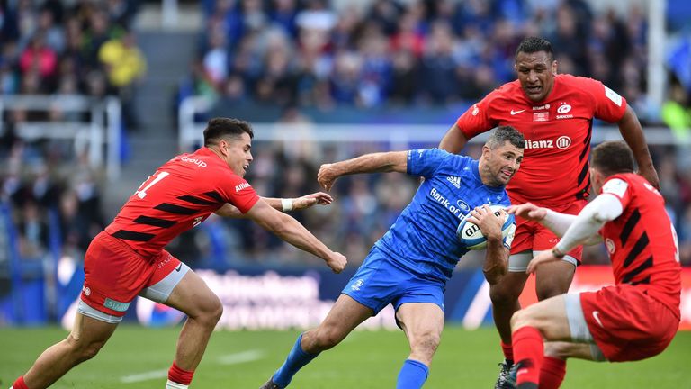 Leinster's Irish full-back Rob Kearney (C) surrounded by Saracens' New Zealand born Scottish wing Sean Maitland (L), Saracens' New Zealand-born English prop Mako Vunipola (2nd R) and Saracens' English scrum-half Ben Spencer (R) during the European Rugby Champions Cup final match between Leinster and Saracens at St James Park stadium in Newcastle-upon-Tyne, north east England on May 11, 2019. (Photo by Glyn KIRK / AFP) (Photo credit should read GLYN KIRK/AFP/Getty Images)