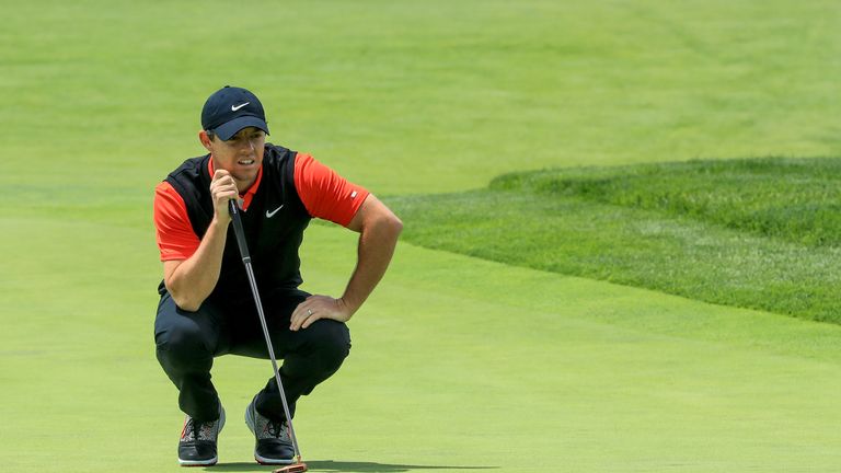 Rory McIlroy assesses a putt at Bethpage Black