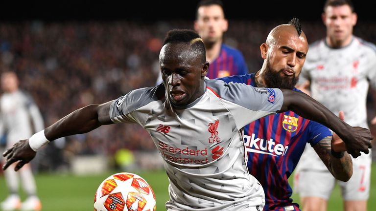 Sadio Mane and Arturo Vidal battle for the ball in Liverpool's game against Barcelona at the Camp Nou