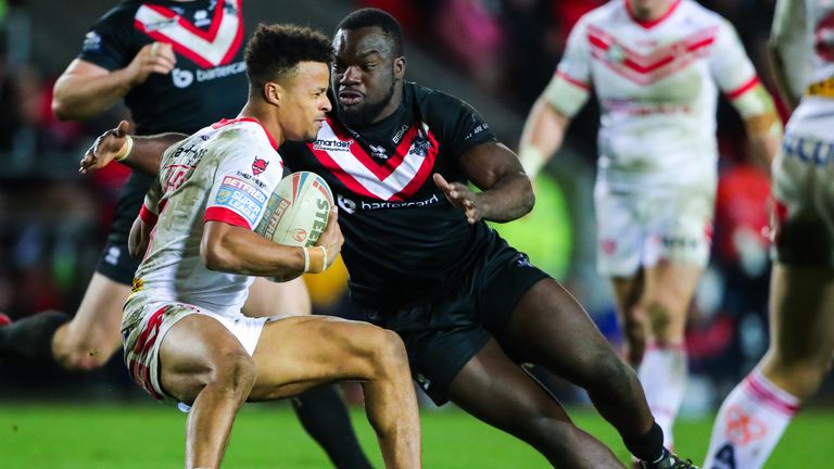 Picture by Alex Whitehead/SWpix.com - 08/03/2019 - Rugby League - Betfred Super League - St Helens v London Broncos - Totally Wicked Stadium, St Helens, England - St Helens' Regan Grace is tackled by London Broncos' Sadiq Adebiyi.