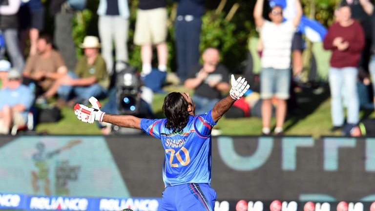 Afghanistan batsman Shapoor Zadran celebrates after hitting the winning runs to defeat Scotland in their 2015 Cricket World Cup Group A match in Dunedin on February 26, 2015. AFP PHOTO / William WEST (Photo credit should read WILLIAM WEST/AFP/Getty Images)