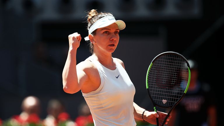 Simona Halep of Romania celebrates in her match against Ashleigh Barty of Australia in the quarter finals during day six of the Mutua Madrid Open at La Caja Magica on May 09, 2019 in Madrid, Spain.