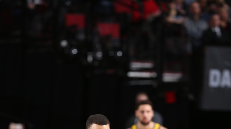 Stephen Curry #30 of the Golden State Warriors handles the ball against Damian Lillard #0 of the Portland Trail Blazers on February 13, 2019 at the Moda Center in Portland, Oregon