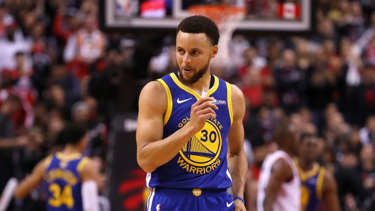 Stephen Curry of the Golden State Warriors reacts against the Toronto Raptors in the second half during Game 1