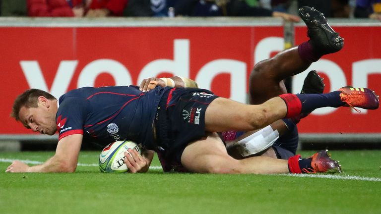 Dane Haylett-Petty crosses for the Rebels against the Reds.