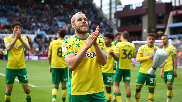 Teemu Pukki celebrates on the pitch at Villa Park after Norwich are confirmed as champions of the Sky Bet EFL Championship