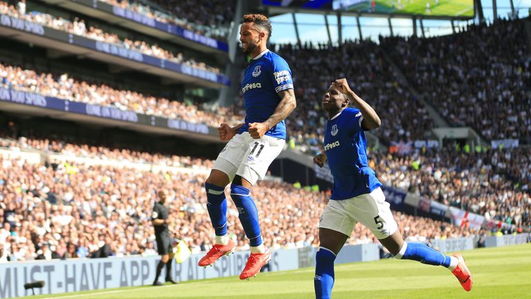 Theo Walcott celebrates hauling Everton level with a fine low finish after 69 minutes