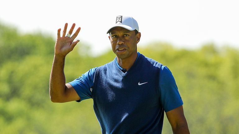 Tiger Woods of the United States reacts to his putt on the 15th green during the first round of the 2019 PGA Championship at the Bethpage Black course on May 16, 2019 in Farmingdale, New York.