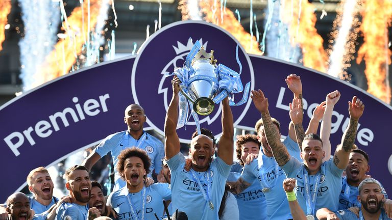 Manchester City captain Vincent Kompany lifts the Premier League trophy