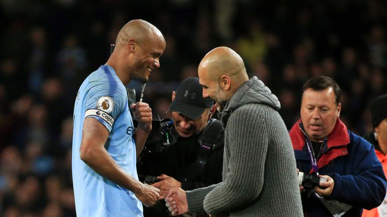 Pep Guardiola celebrates Man City's 1-0 win over Leicester with goalscorer Vincent Kompany