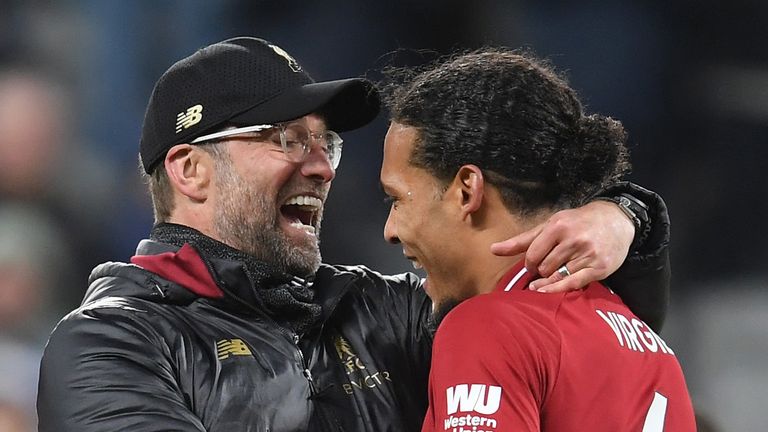 Jurgen Klopp of Liverpool celebrates victory with Virgil Van Dijk during the Premier League match between Newcastle United and Liverpool FC at St. James Park on May 04, 2019 in Newcastle upon Tyne, United Kingdom. 