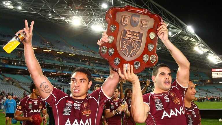 Willie Tonga and Greg Inglis of the Maroons hold up the trophy after winning game three of the ARL State of Origin series between the New South Wales Blues and the Queensland Maroons at ANZ Stadium on July 7, 2010 in Sydney, Australia