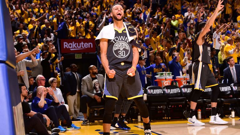 Stephen Curry celebrates a Klay Thompson three-pointer during Golden State's Game 2 win over the Houston Rockets