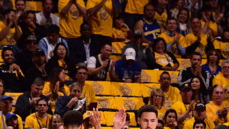 Stephen Curry high-fives Warriors team-mate Klay Thompson during Game 1 of the Western Conference Finals