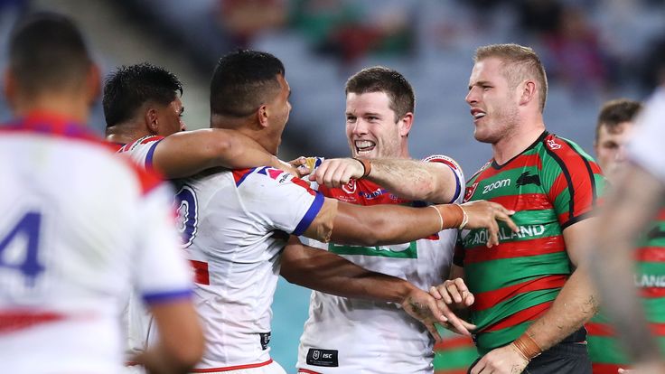 SYDNEY, AUSTRALIA - JUNE 07: Daniel Saifiti and Lachlan Fitzgibbon of the Knights celebrate as Tom Burgess of the Rabbitohs looks dejected during the round 13 NRL match between the South Sydney Rabbitohs and the Newcastle Knights at ANZ Stadium on June 07, 2019 in Sydney, Australia. (Photo by Mark Kolbe/Getty Images)