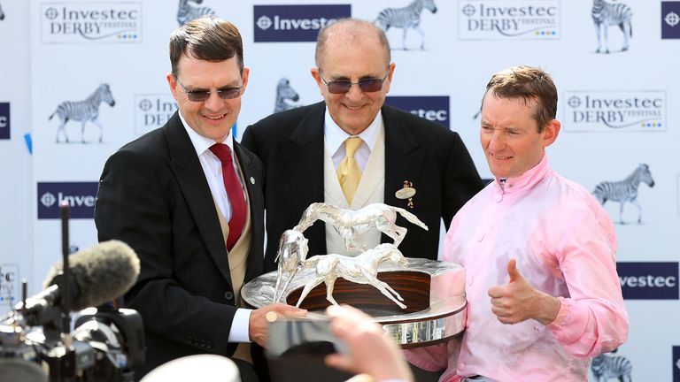 Jockey Seamie Heffernan (right) and Trainer Aidan O'Brien with the trophy for the Investec Derby Stakes with Anthony Van Dyck during Derby Day of the 2019 Investec Derby Festival at Epsom Racecourse, Epsom. PRESS ASSOCIATION Photo. Picture date: Saturday June 1, 2019. See PA story RACING Epsom. Photo credit should read: Simon Cooper/PA Wire. RESTRICTIONS: Editorial Use only, commercial use is subject to prior permission from The Jockey Club