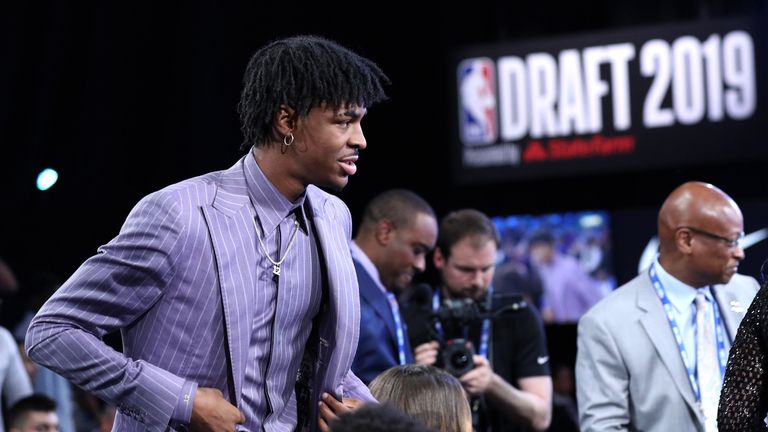 Ja Morant walks to the stage after being taken second in the NBA Draft