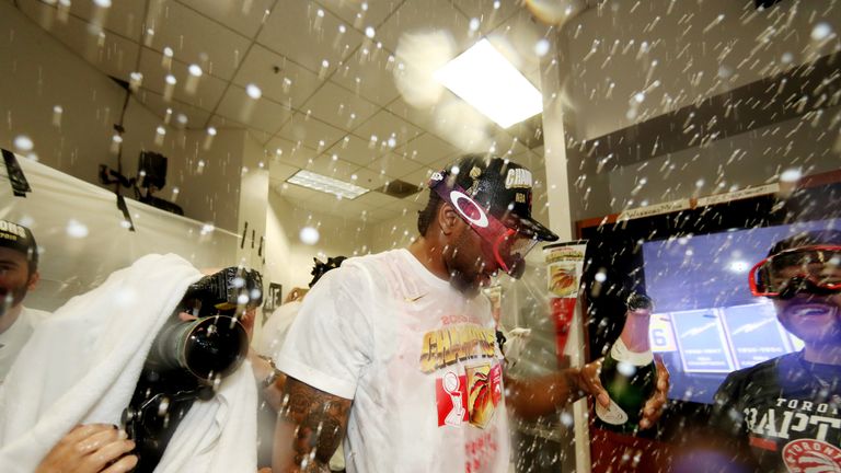 Kawhi Leonard lets the champagne fly following the Toronto Raptors&#39; NBA title win