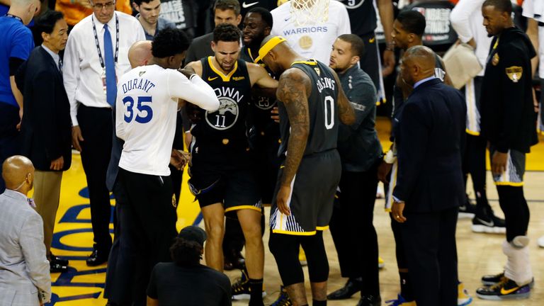 Klay Thompson is helped off the court after tearing his ACL in Game 6 of the NBA Finals