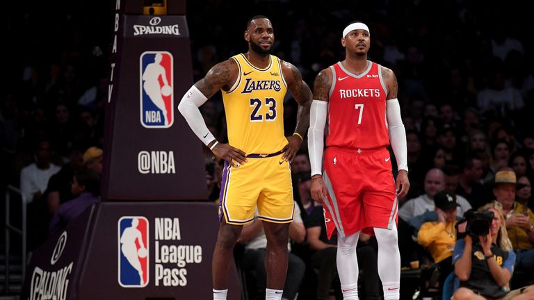LeBron James and Carmelo Anthony on court in a Lakers-Rockets clash