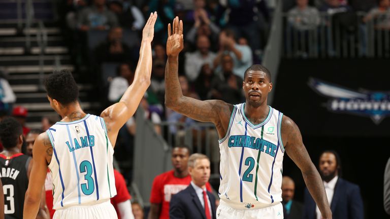 Marvin Williams high-fives team-mate Jeremy Lamb