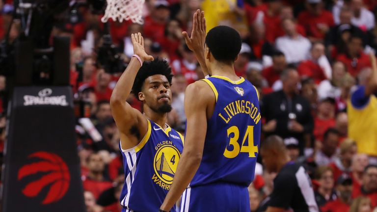 Quinn Cook and Shaun Livingston celebrate a made basket for the Warriors in Game 2