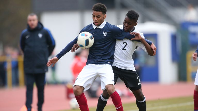 Bote Nzuzi Baku of Germany challenges Alexis Claude-Maurice of France during the friendly match between U18 Germany and U18 France at Saar-Mosel-Stadium on March 24, 2016 in Konz, Germany.