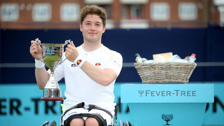 Alfie Hewett of Great Britain poses for a photo with his trophy after the Men's singles wheelchair final against Gordon Reid of Great Britain during day seven of the Fever-Tree Championships at Queens Club on June 23, 2019 in London, United Kingdom