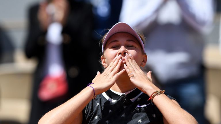 Amanda Anisimova of the US celebrates after winning against Romania's Simona Halep at the end of their women's singles quarter-final match on day twelve of The Roland Garros 2019 French Open tennis tournament in Paris on June 6, 2019