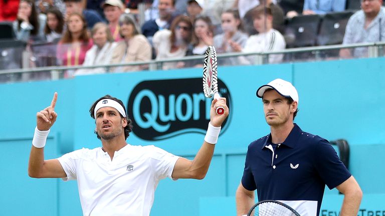 Andy Murray of Great Britain and partner Feliciano Lopez of Spain celebrates a break of serve in the mens doubles final against Rajeev Ram of The United States and Joe Salisbury