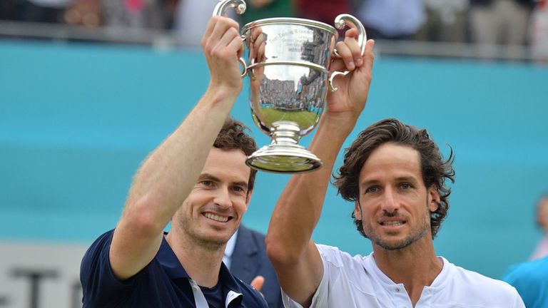 Andy Murray (L) and Spain's Feliciano Lopez pose with the trophy after their win in the men's doubles final tennis match against US player Rajeev Ram and Britain's Joe Salisbury at the ATP Fever-Tree Championships tournament at Queen's Club in west London on June 23, 2019