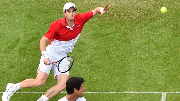 Andy Murray (L) and Brazil's Marcelo Melo return to Colombia's Juan Sebastian Cabal and Robert Farah during their men's doubles round of 16 match at the ATP Nature valley International tennis tournament in Eastbourne, southern England on June 25, 2019