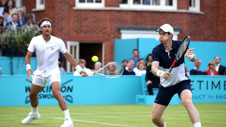 Andy Murray of Great Britain partner of Feliciano Lopez of Spain plays a backhand during their mens doubles first round match against Juan Sebastian cabal of Columbia and Robert Farah of Columbia during day four of the Fever-Tree Championships at Queens Club on June 20, 2019 in London, United Kingdom. 